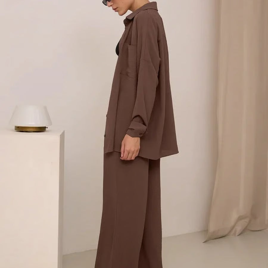 Elegant feminine set consisting of shirt and trousers