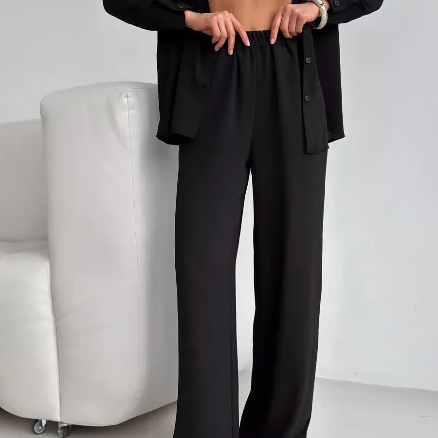 Elegant feminine set consisting of shirt and trousers