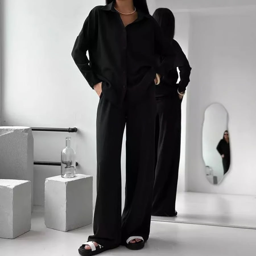 Elegant feminine set consisting of shirt and trousers